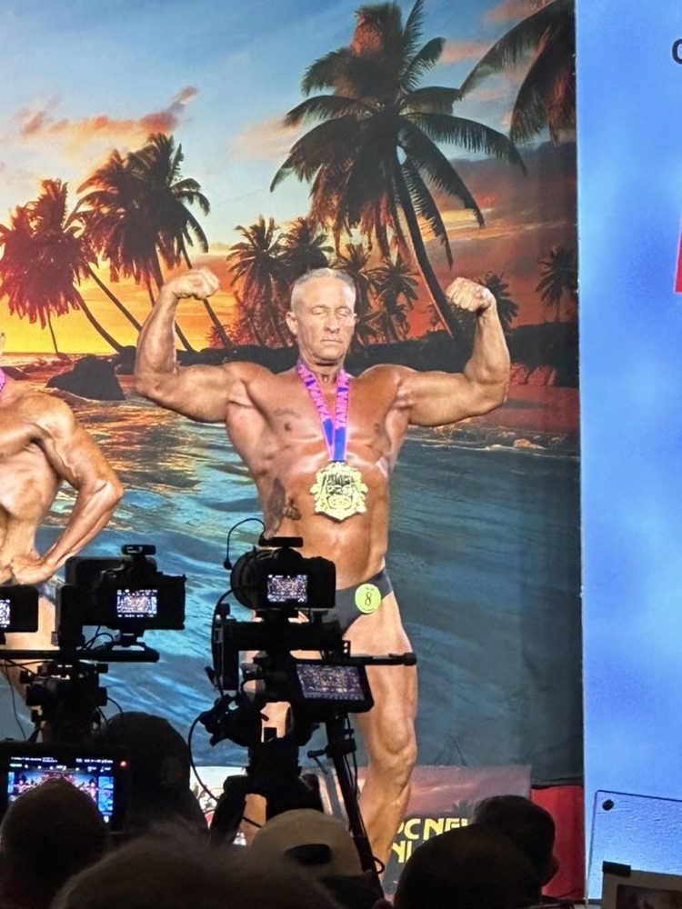 Nick on stage with his medal at the Tampa Pro